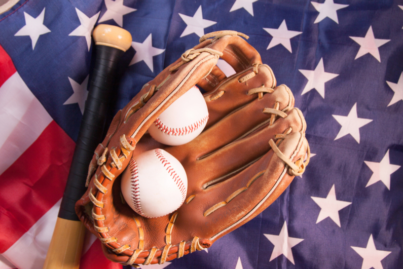 Baseball with glove and American flag