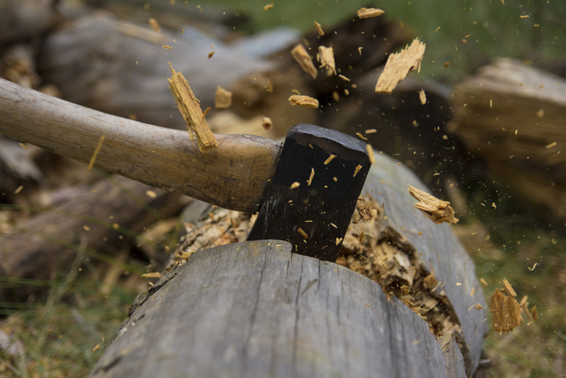 Axe cutting wood.